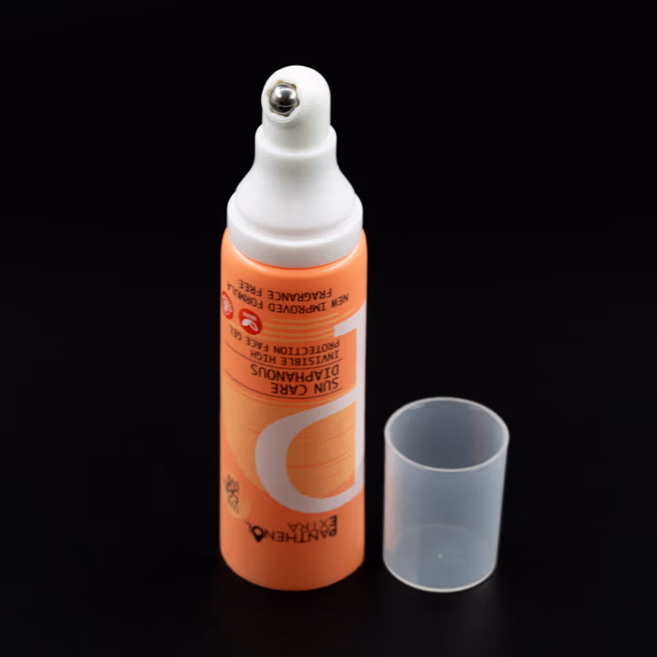 Metal aplikatör uçlu turuncu airless tüp, şeffaf kapaklı kapağı açık